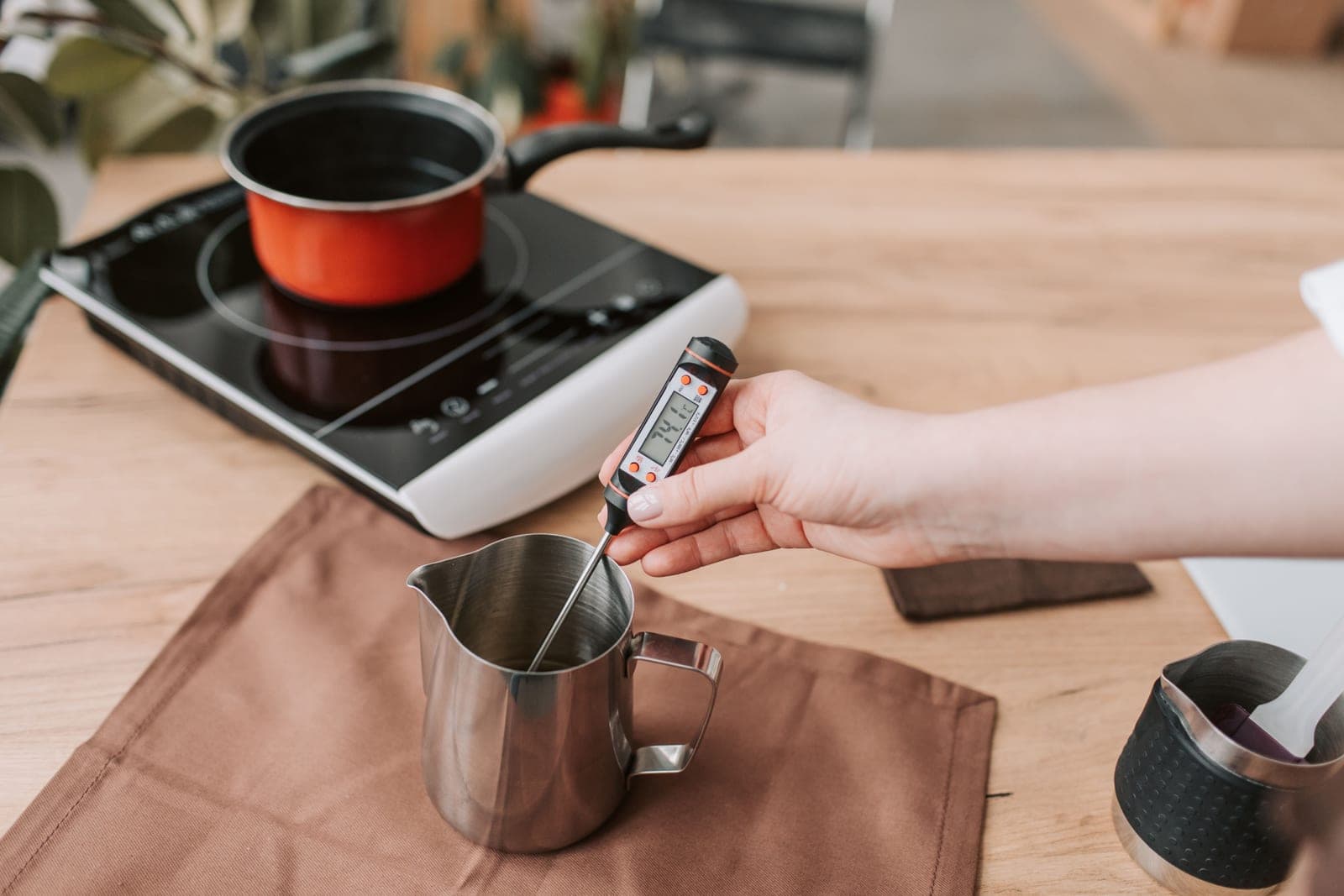 A digital probe thermometer on a bright kitchen surface