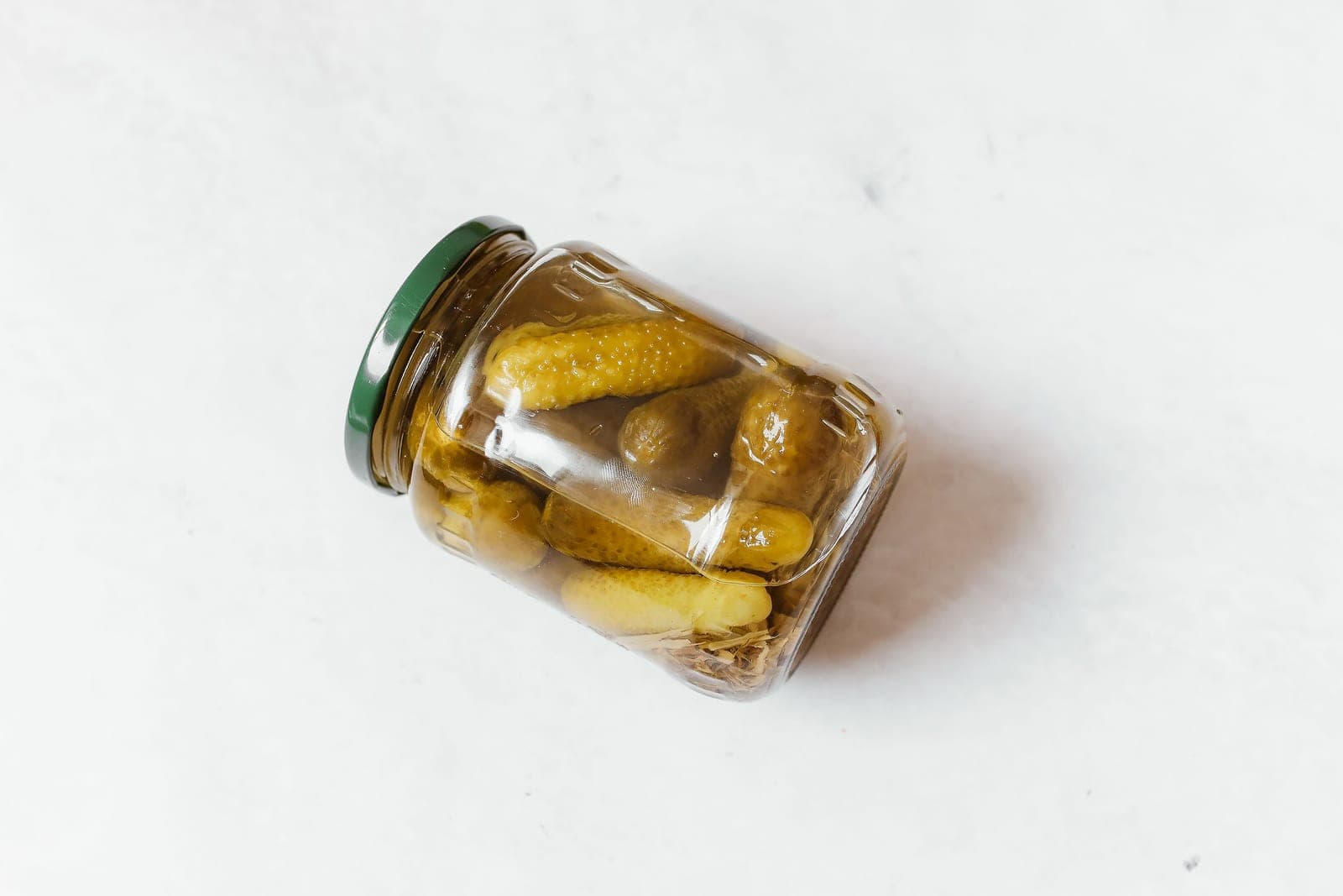 A close view of the liquid surface inside a fermentation jar