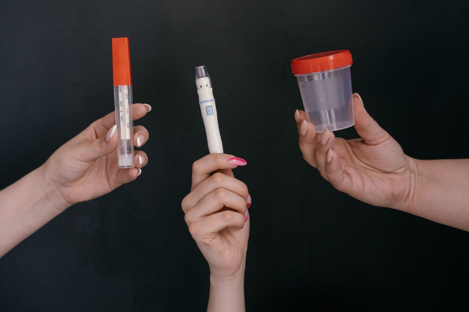 pH test strips and a thermometer laid out on a bright white laboratory surface